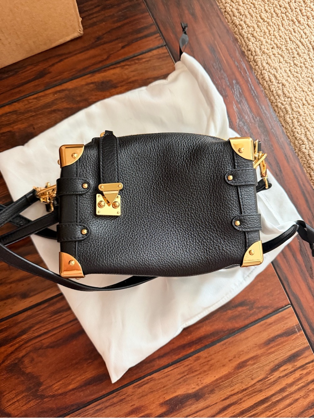 Black leather box bag with strap